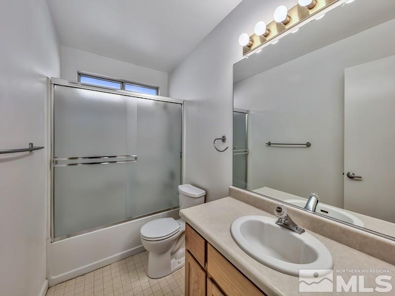 2301 Cordilla Court Reno, NV 89523 - Photo 14 of 18 a bathroom with a sink toilet and shower