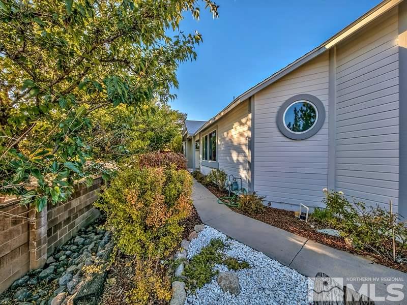 2301 Cordilla Court Reno, NV 89523 - Photo 3 of 18 a view of a pathway of a house with a flower garden