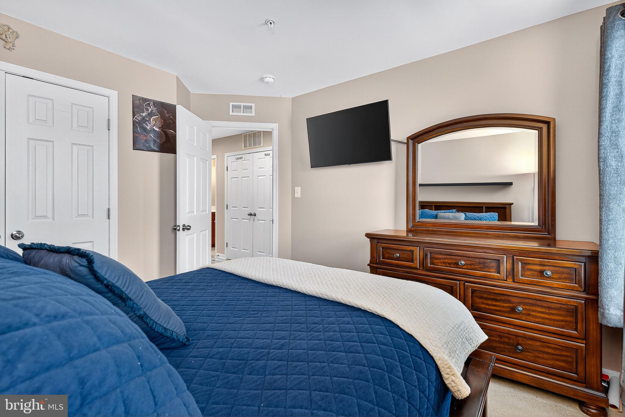 671 English Ivy Way Aberdeen, MD 21001 - Photo 17 of 30 a bedroom with a bed and a flat screen tv