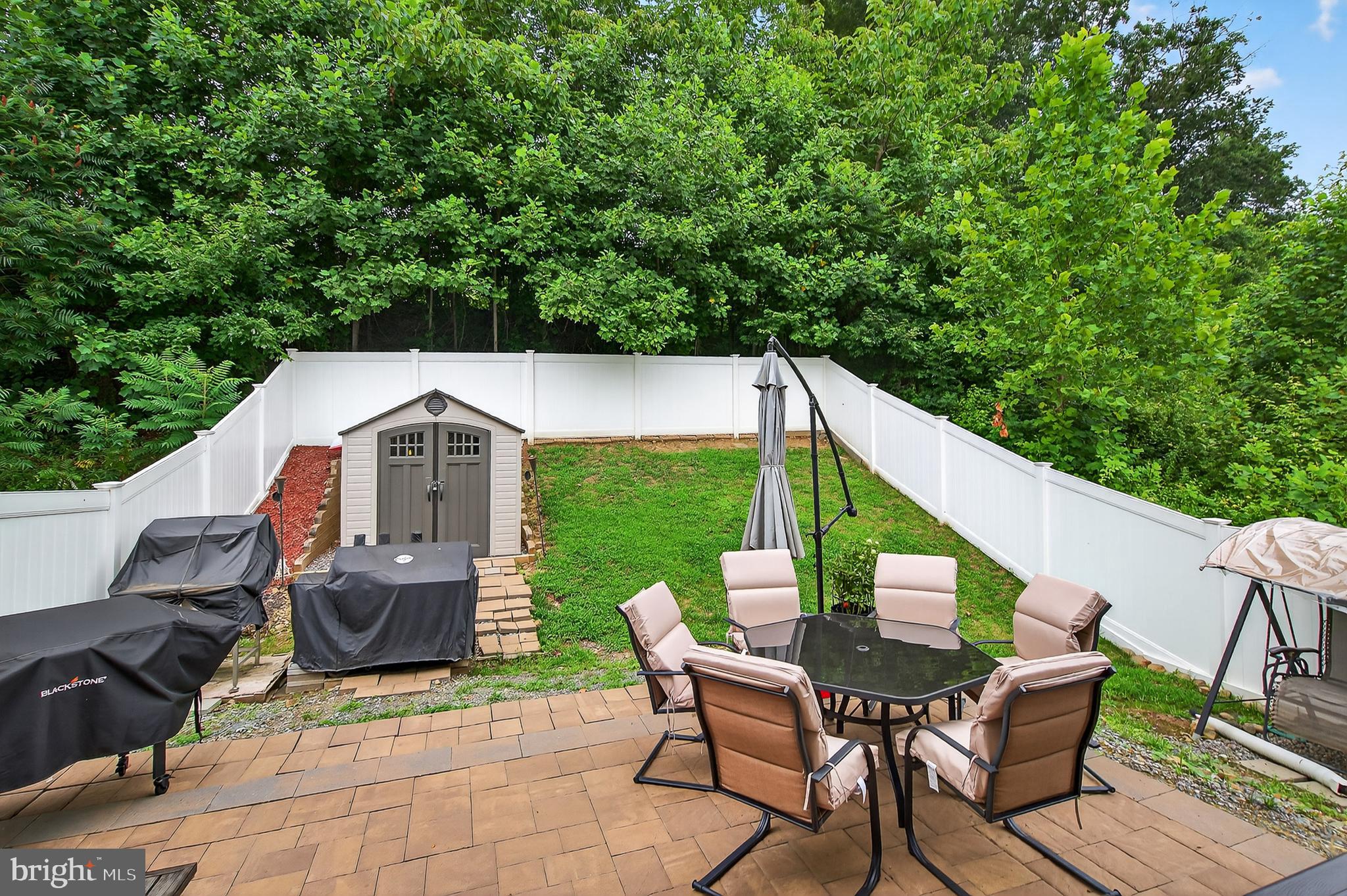 671 English Ivy Way Aberdeen, MD 21001 - Photo 24 of 30 a backyard of a house with table and chairs