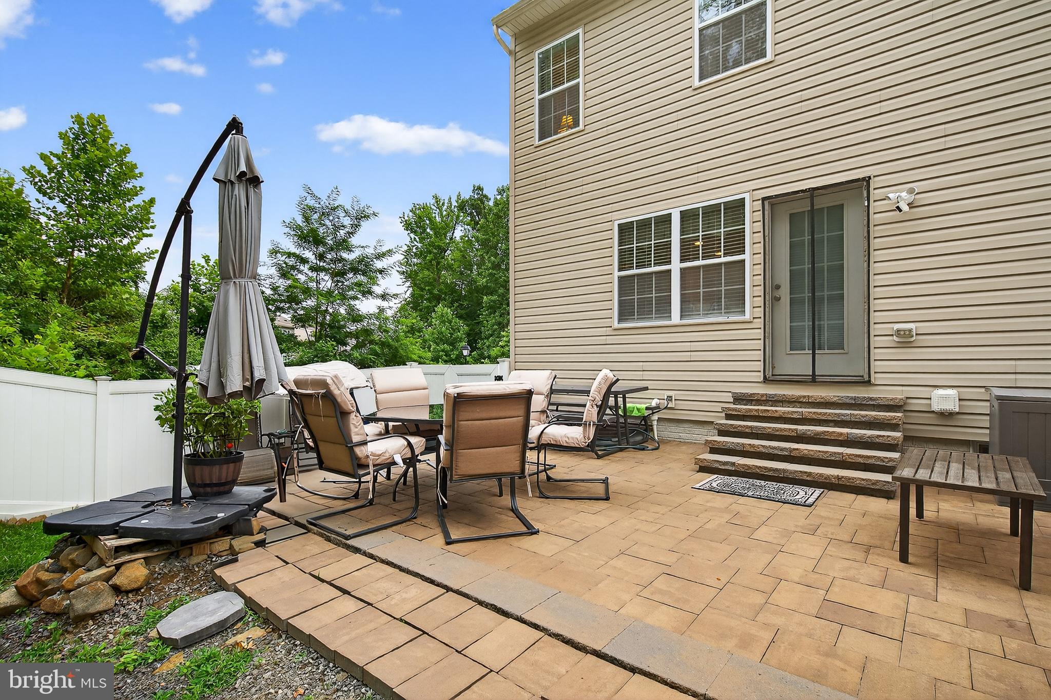 671 English Ivy Way Aberdeen, MD 21001 - Photo 25 of 30 a view of a patio with a table and chairs