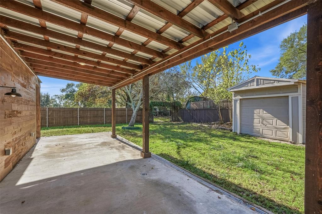 9938 John Flowers Road Wills Point, TX 75169 - Photo 26 of 40 Fenced backyard featuring a patio area and an outdoor structure