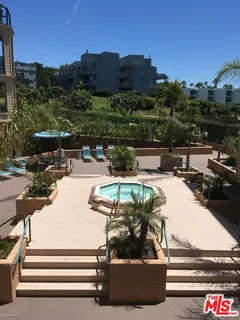 a view of a terrace with sitting area