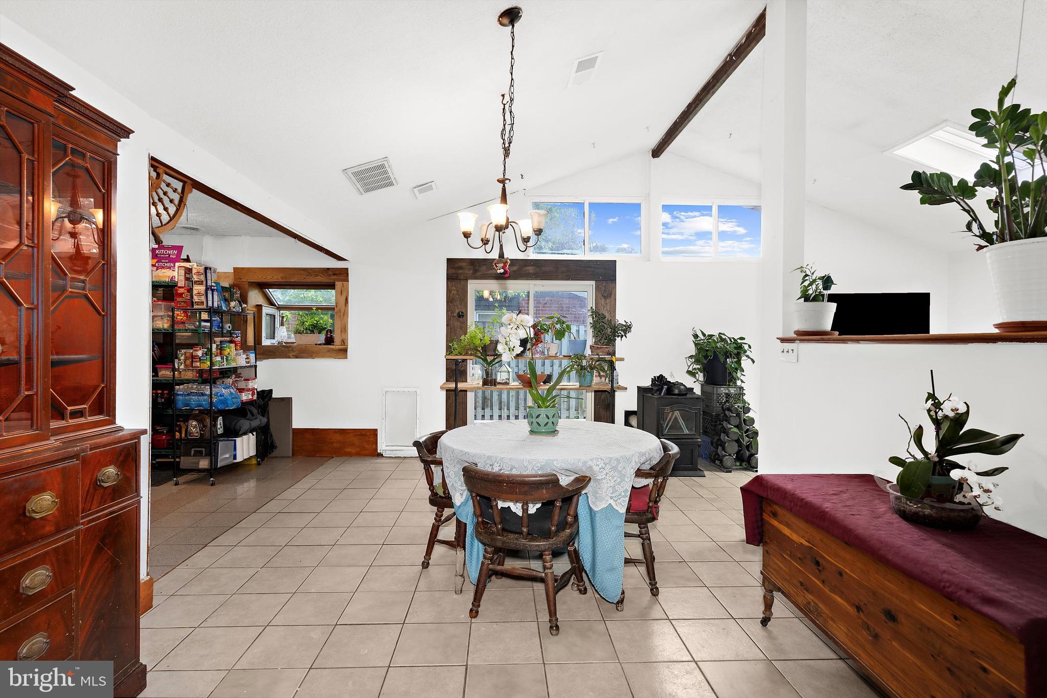 902 Joppa Farm Road Joppa, MD 21085 - Photo 12 of 34 a view of a dining room with furniture and chandelier
