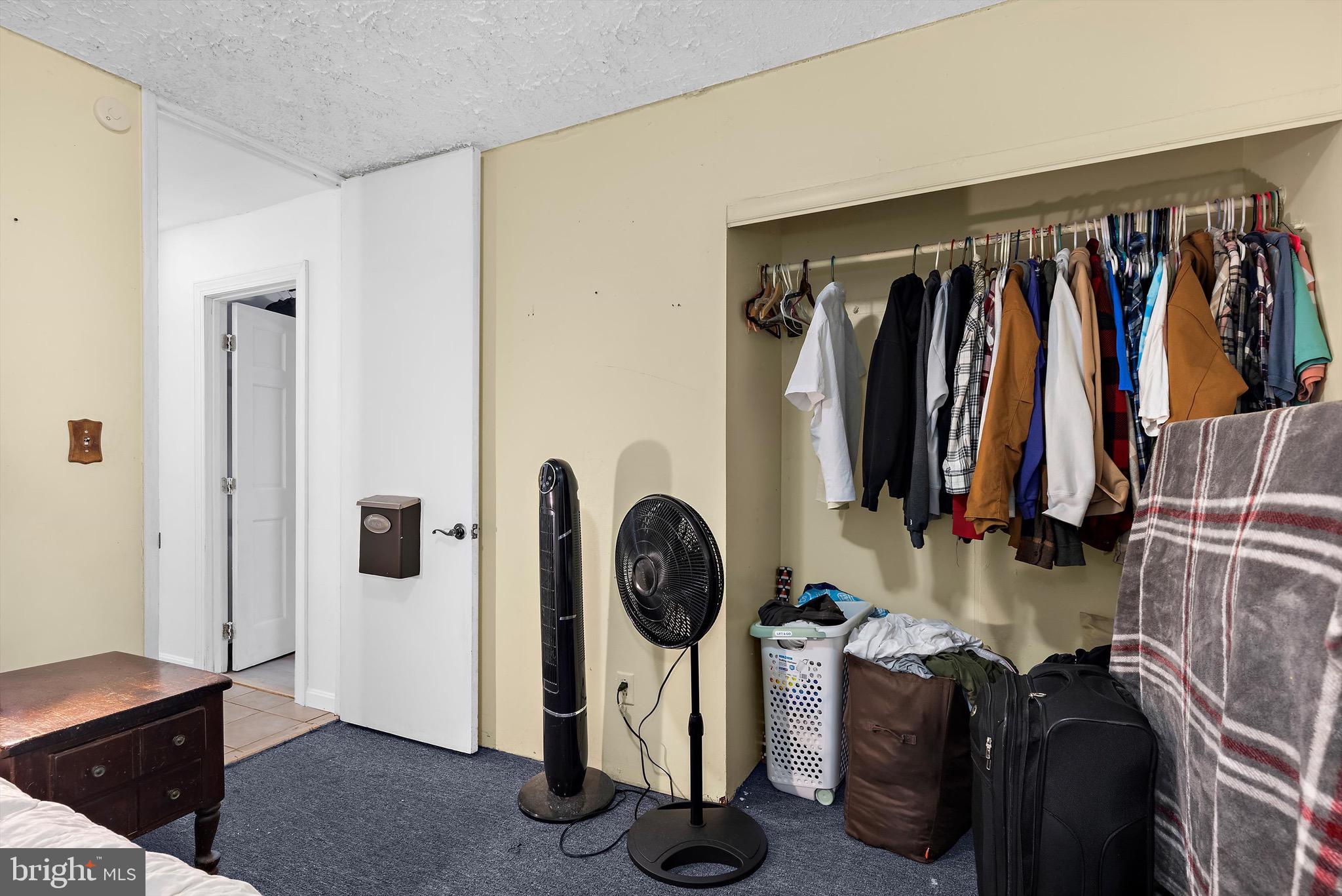 902 Joppa Farm Road Joppa, MD 21085 - Photo 24 of 34 a view of walk in closet with clothes and shoes
