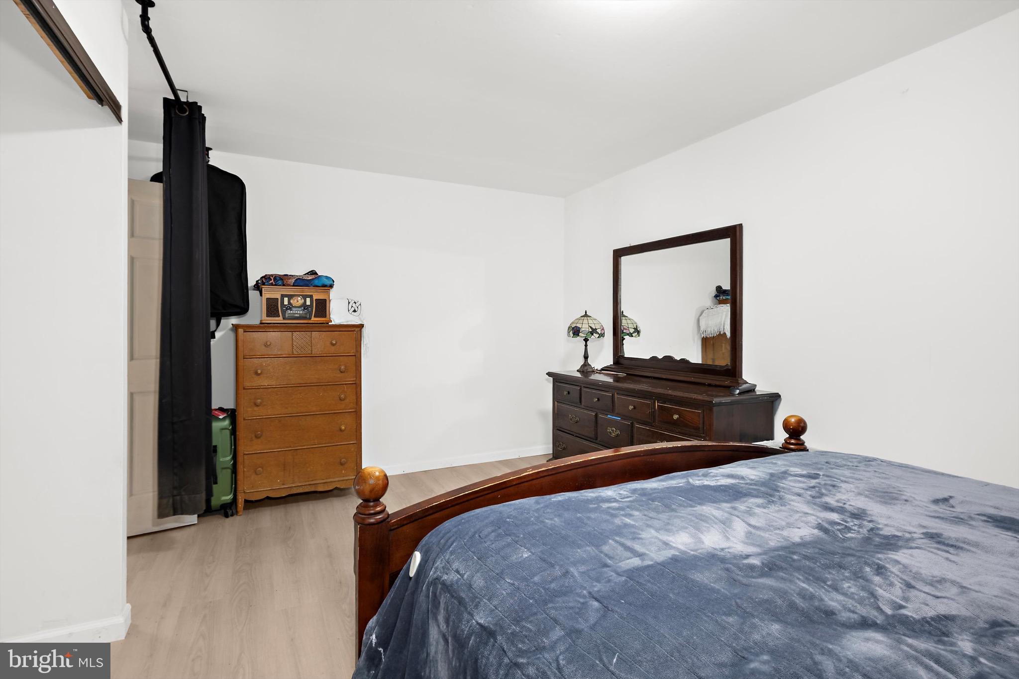 902 Joppa Farm Road Joppa, MD 21085 - Photo 26 of 34 a bedroom with a bed and a dresser