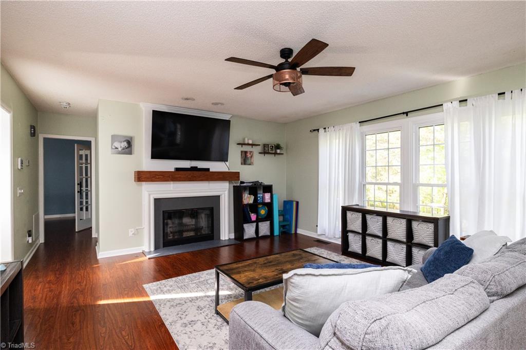 1403 Spring Tree Court High Point, NC 27265 - Photo 12 of 35 Den with wood burning fireplace. Gas hook ups installed.