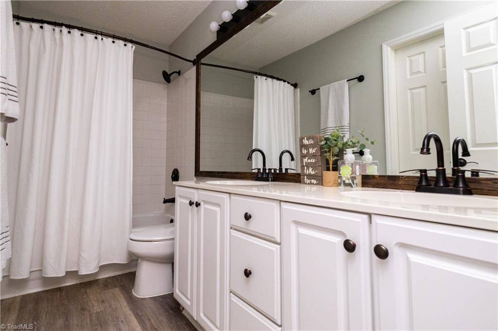 1403 Spring Tree Court High Point, NC 27265 - Photo 27 of 35 Full bathroom upstairs. Double vanities and tub.