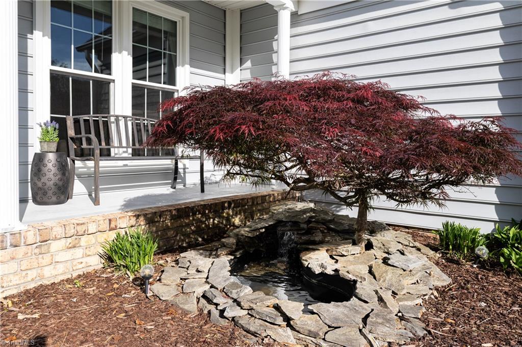 1403 Spring Tree Court High Point, NC 27265 - Photo 3 of 35 Tranquil pond water feature at front entrance welcomes you.