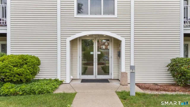 a front view of a house with a porch