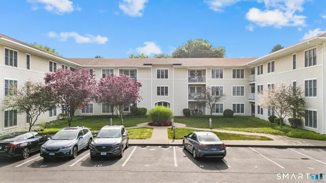 a front view of a house with swimming pool having outdoor seating