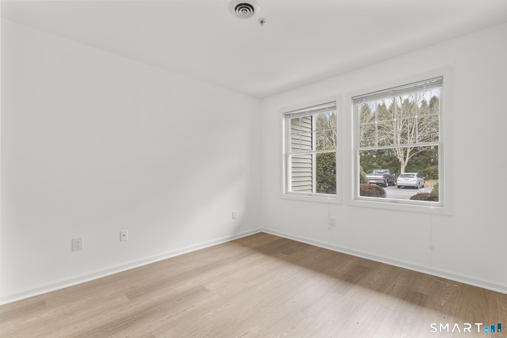 468 Main Street, Unit 111 East Lyme, CT 06357 - Photo 19 of 37 an empty room with a window