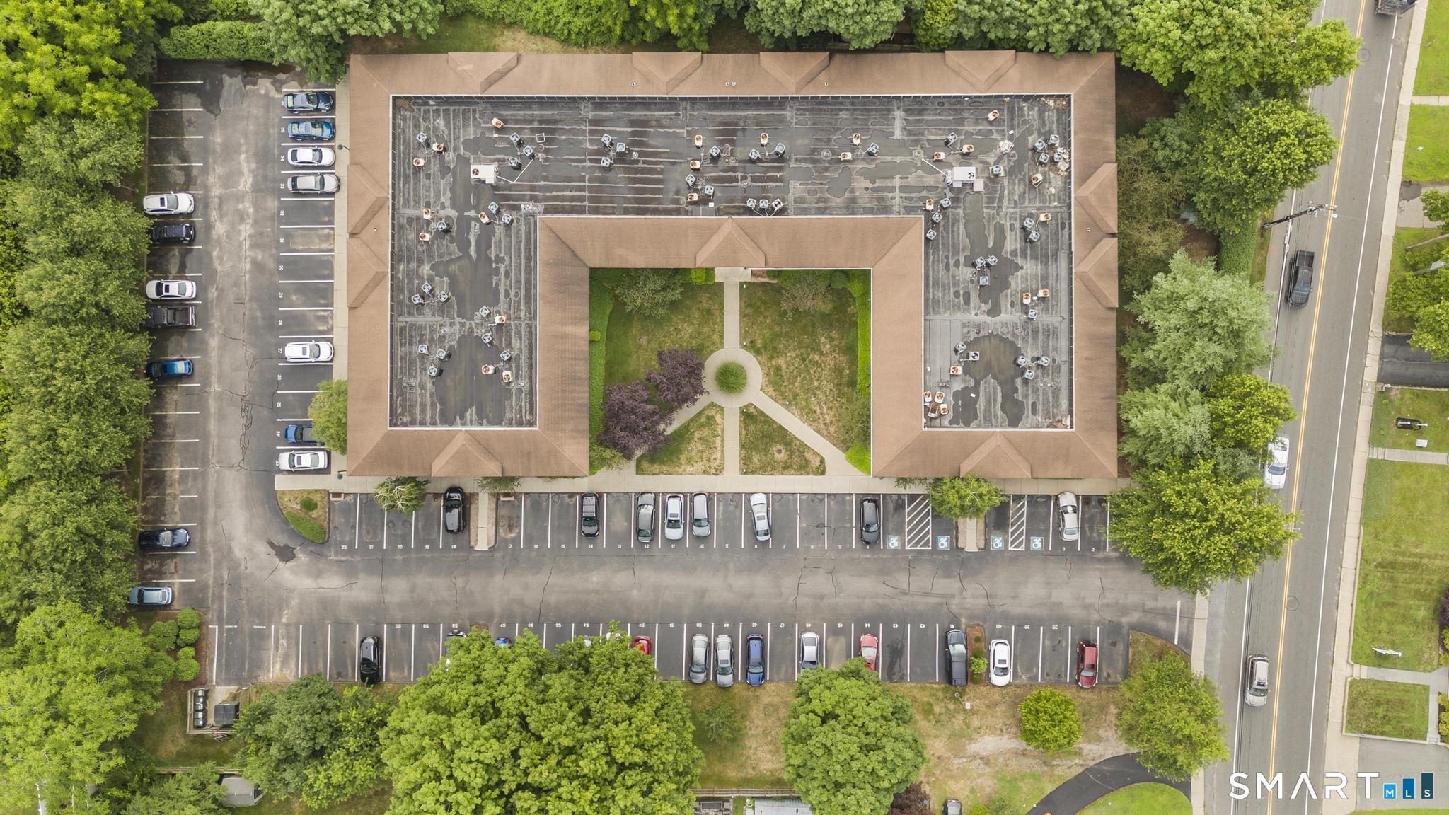 468 Main Street, Unit 111 East Lyme, CT 06357 - Photo 2 of 37 a sign that is on the side of a building