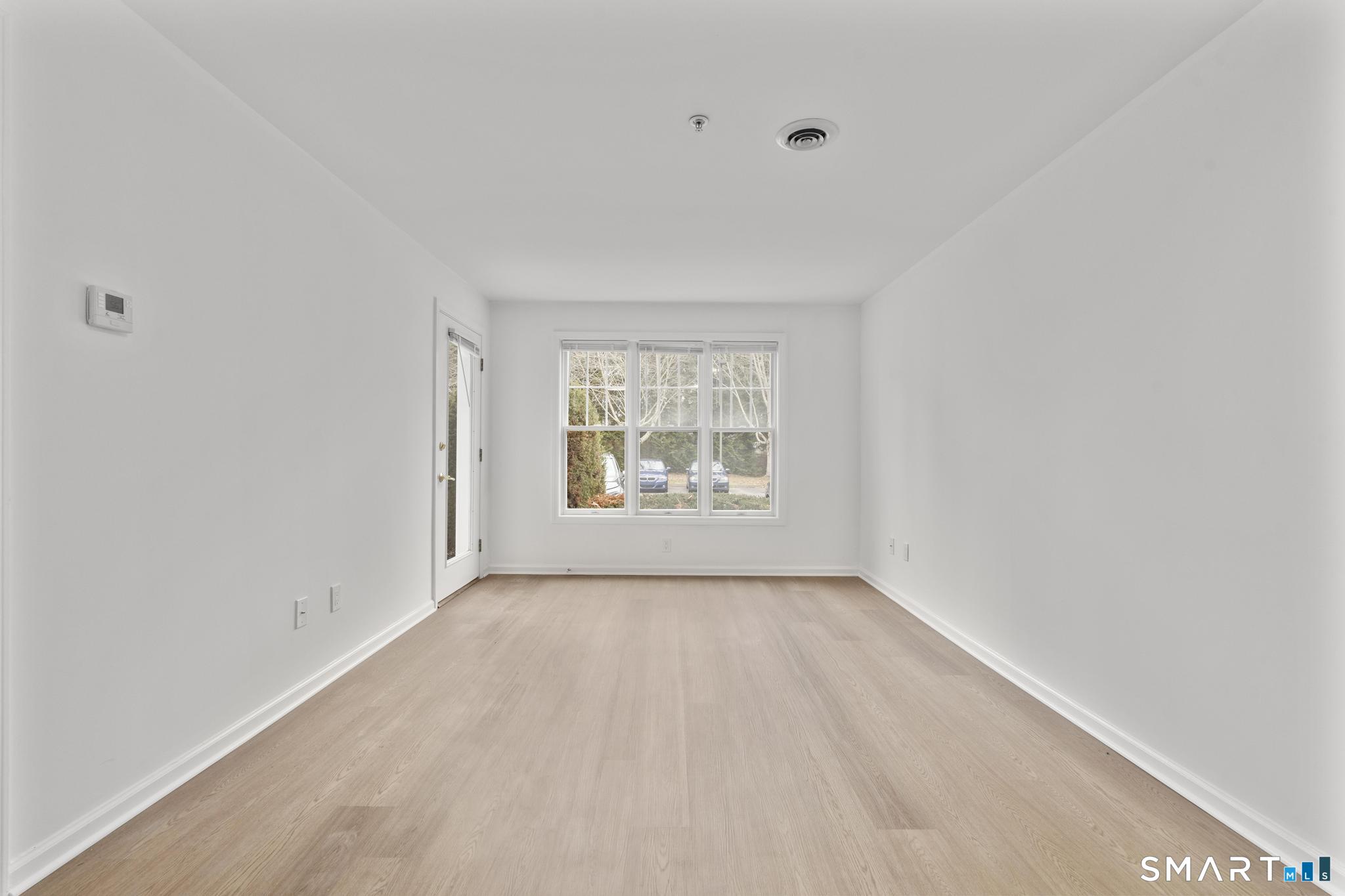 468 Main Street, Unit 111 East Lyme, CT 06357 - Photo 23 of 37 a view of an empty room with a window