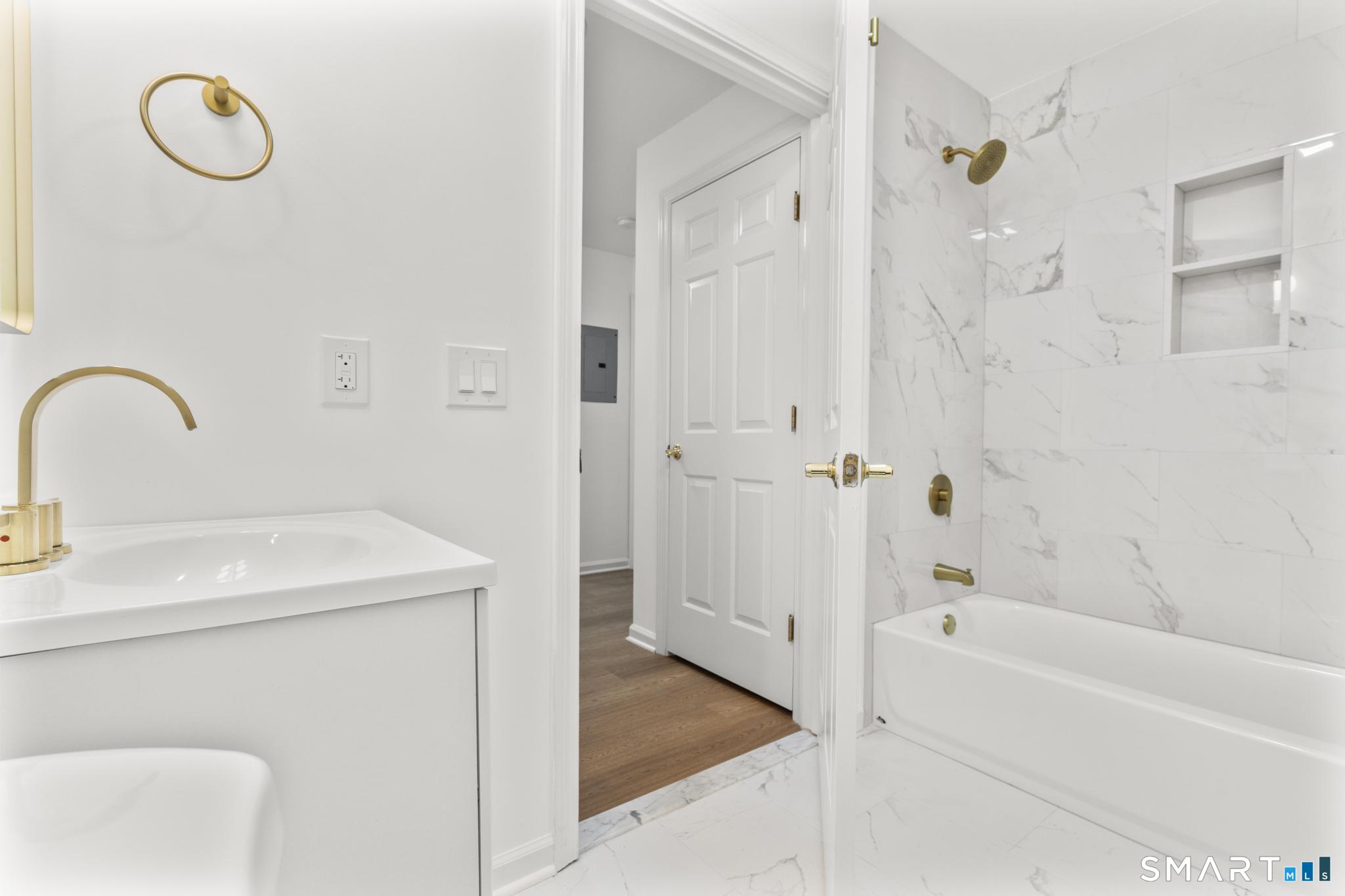 468 Main Street, Unit 111 East Lyme, CT 06357 - Photo 25 of 37 a bathroom with a sink a toilet and shower