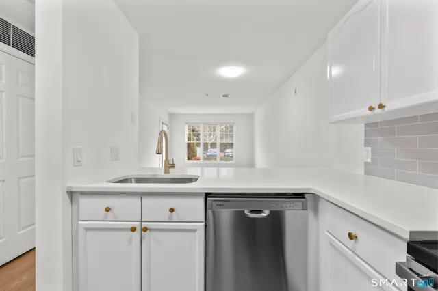 a kitchen with a sink and cabinets