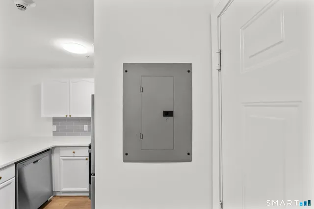 a bathroom with a granite countertop sink mirror and vanity