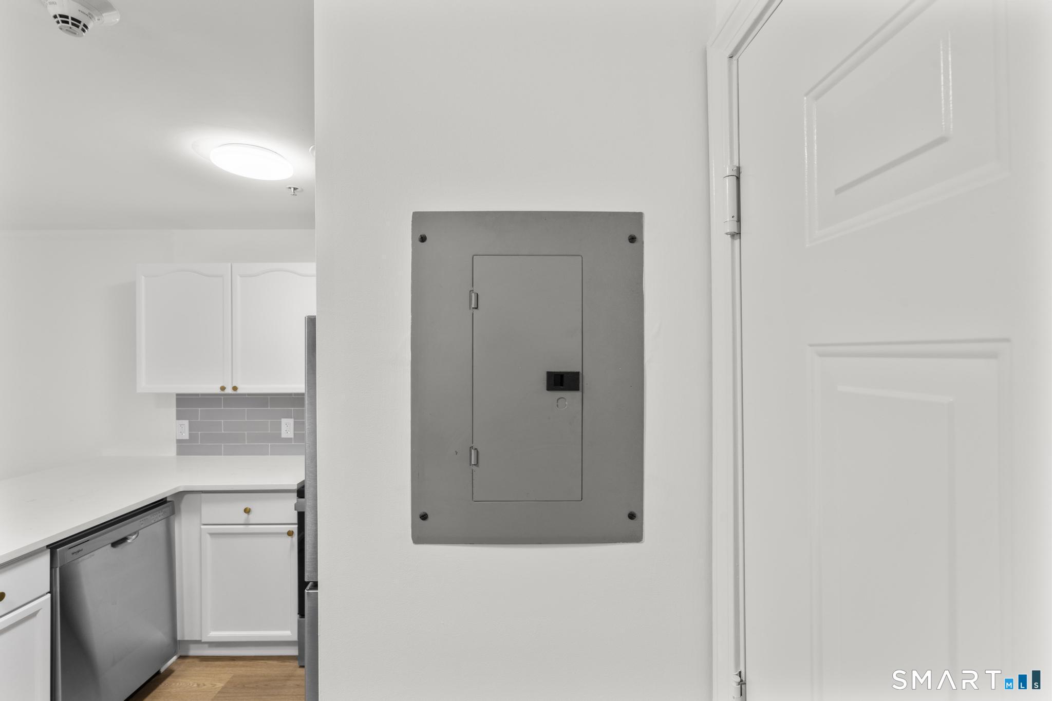 468 Main Street, Unit 111 East Lyme, CT 06357 - Photo 36 of 37 a bathroom with a granite countertop sink mirror and vanity