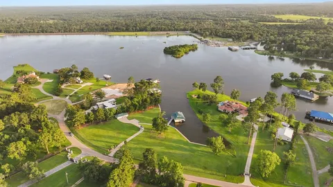 an aerial view of a house with a lake view
