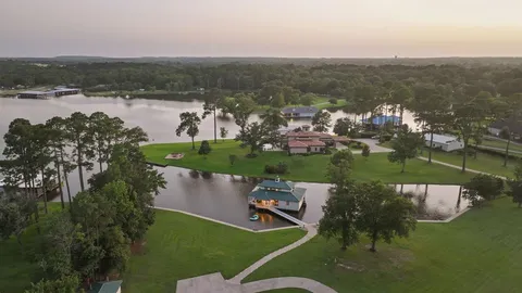 an aerial view of a house with a lake view