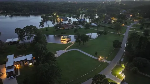 an aerial view of a house with a yard