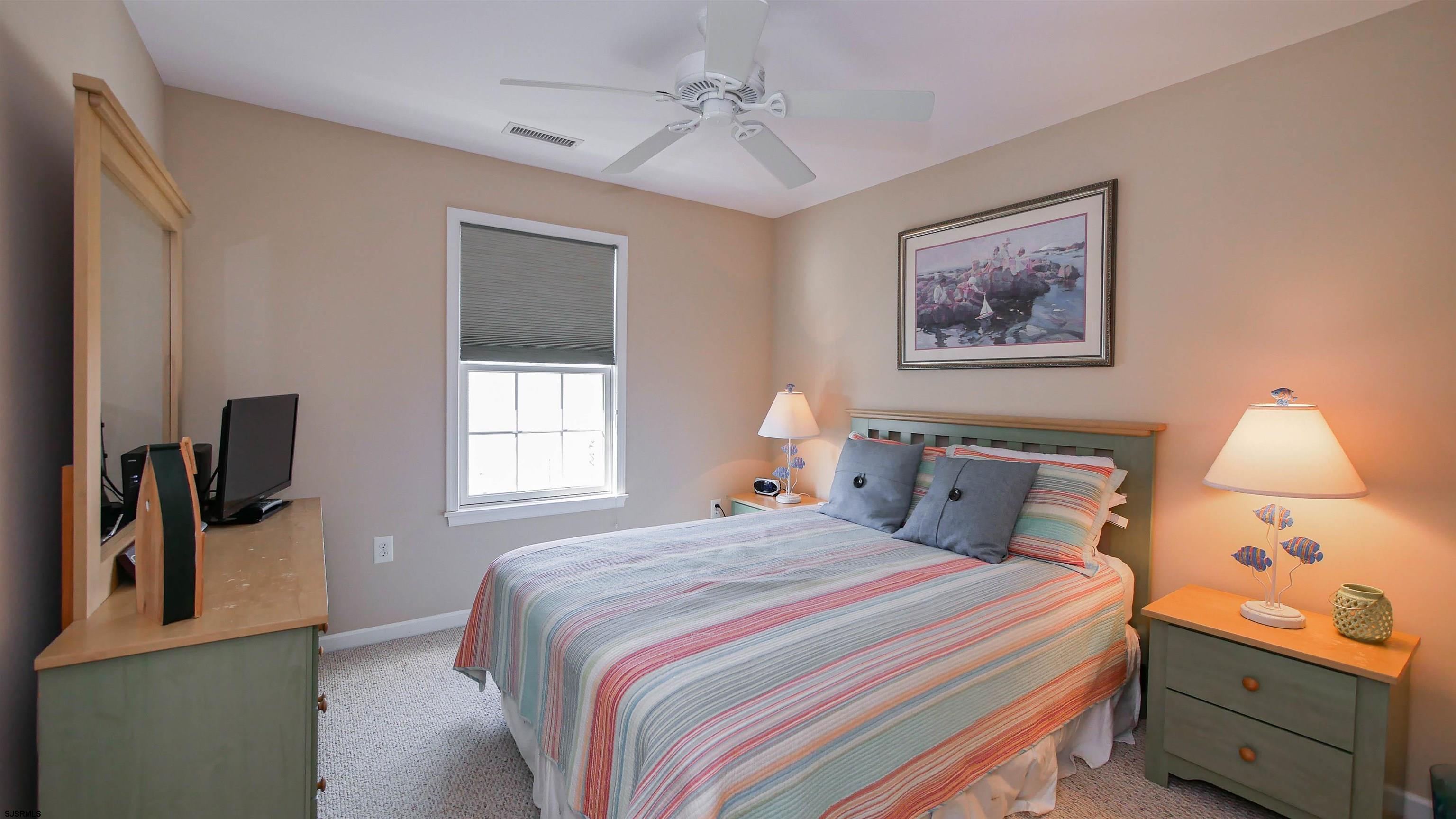 1910 Central Avenue, Unit B Ocean City, NJ 08226 - Photo 18 of 45 a bedroom with a bed and a window