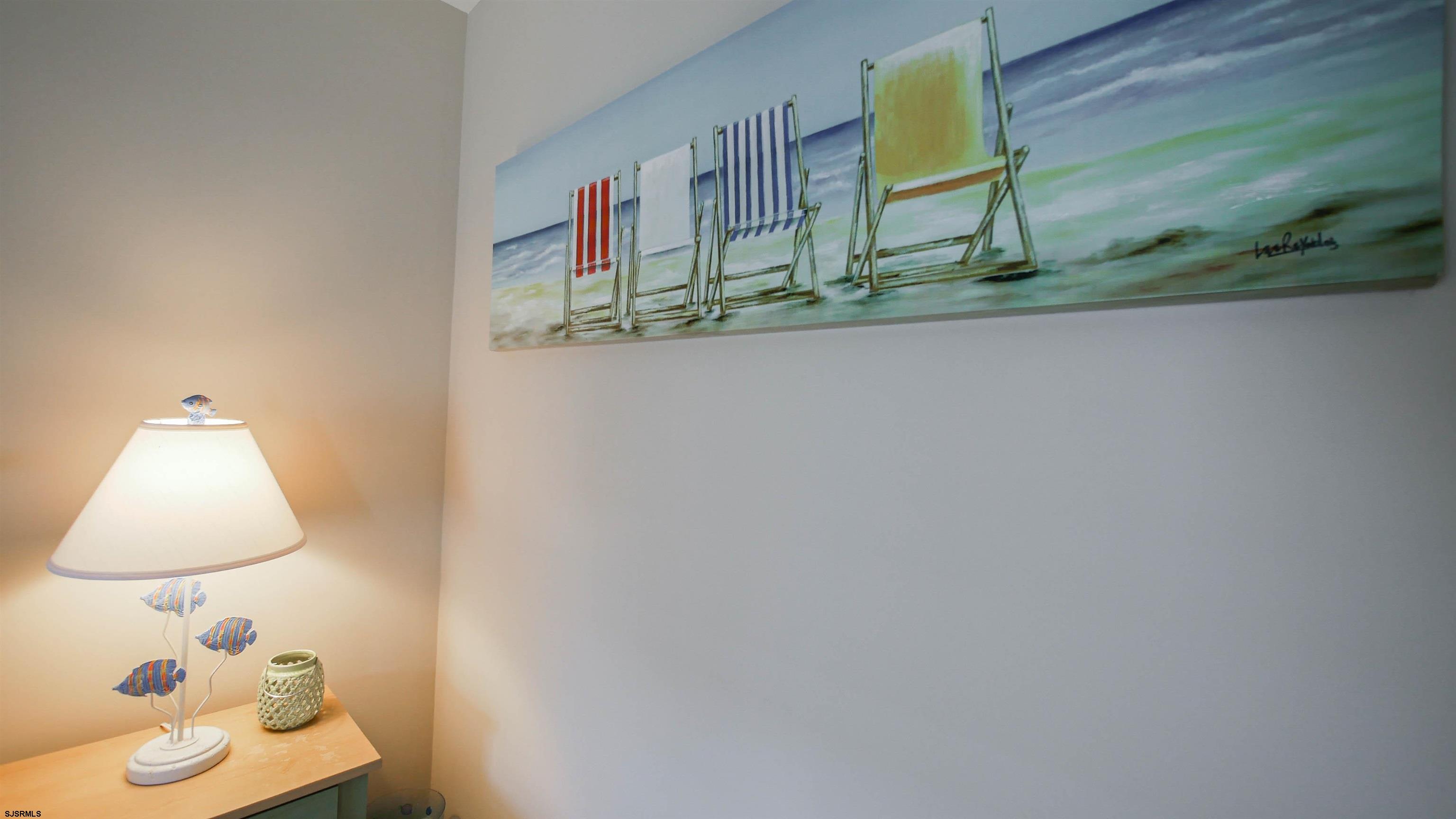 1910 Central Avenue, Unit B Ocean City, NJ 08226 - Photo 20 of 45 a bathroom with a sink and a mirror