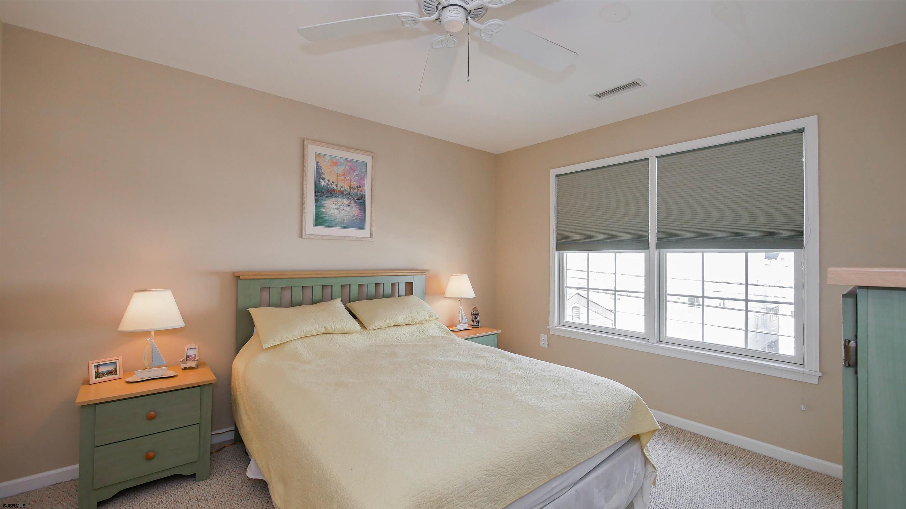 1910 Central Avenue, Unit B Ocean City, NJ 08226 - Photo 23 of 45 a bedroom with a bed and a window