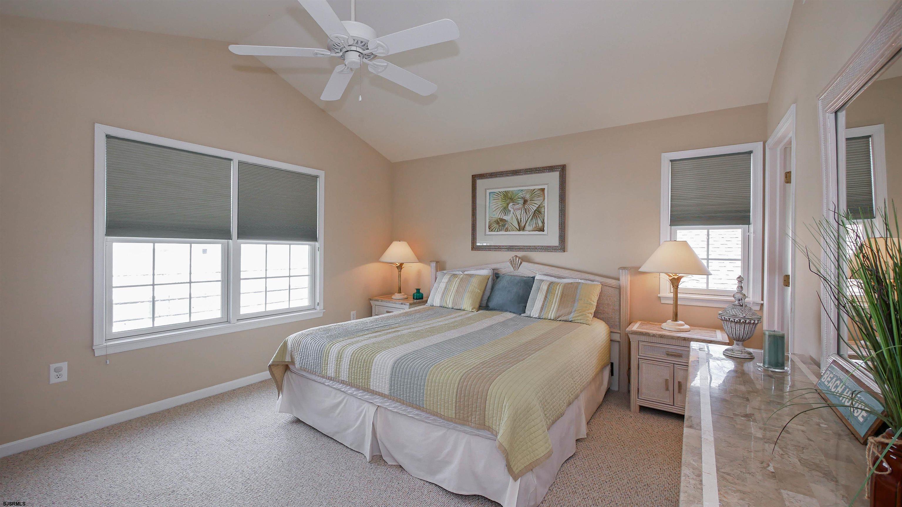 1910 Central Avenue, Unit B Ocean City, NJ 08226 - Photo 25 of 45 a bedroom with a large bed and a window