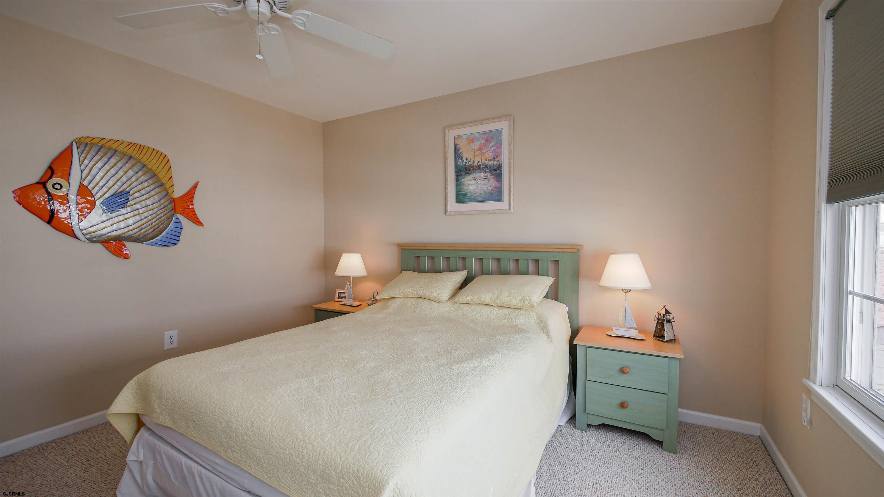 1910 Central Avenue, Unit B Ocean City, NJ 08226 - Photo 32 of 45 a bedroom with a bed and a window