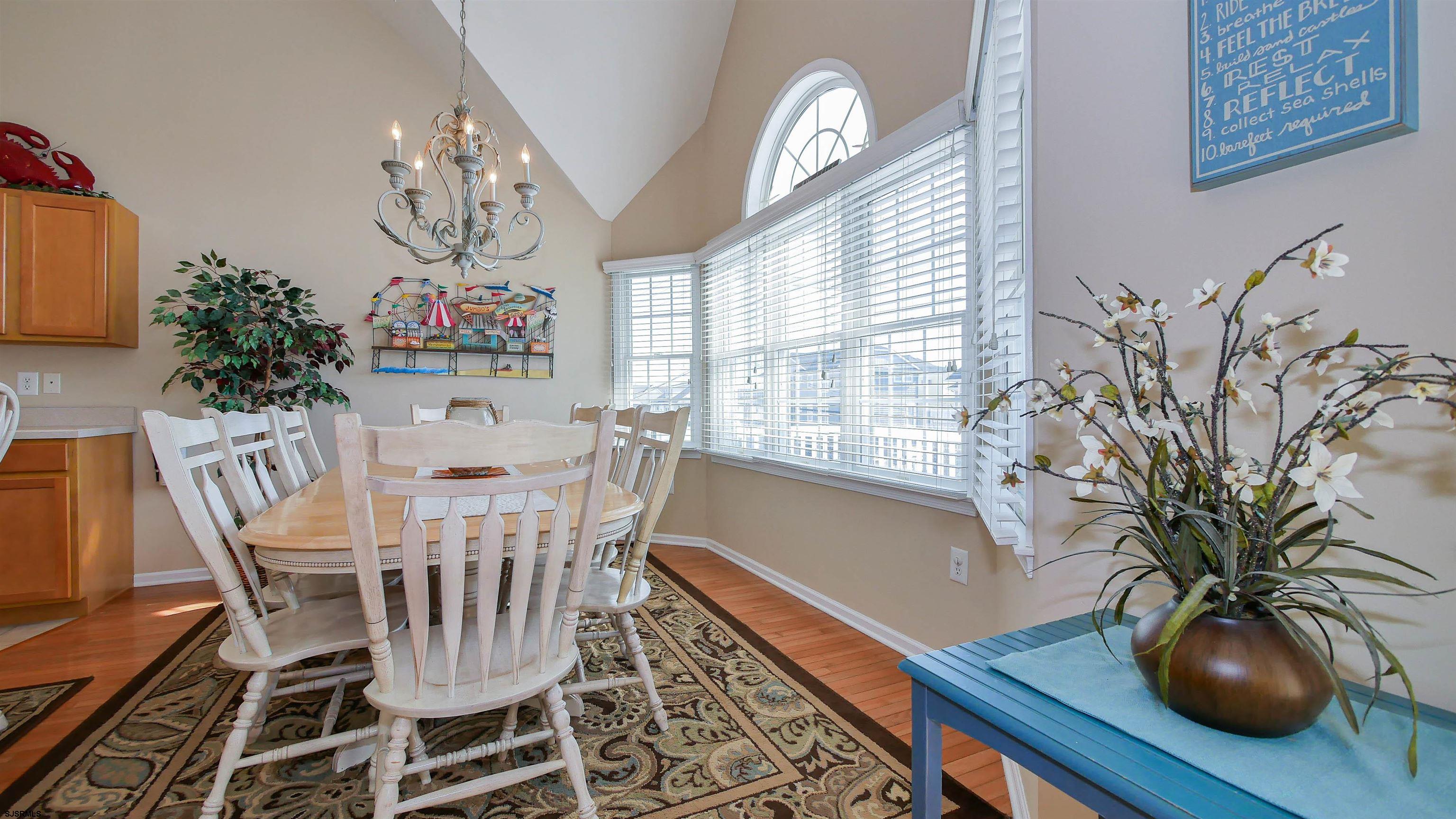 1910 Central Avenue, Unit B Ocean City, NJ 08226 - Photo 6 of 45 a view of a dining room with furniture window and wooden floor