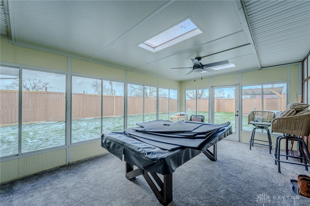 305 South Vandemark Road Sidney, OH 45365 - Photo 31 of 32 This sunroom offers abundant natural light and seamless connection to the outdoors, perfect for relaxation.