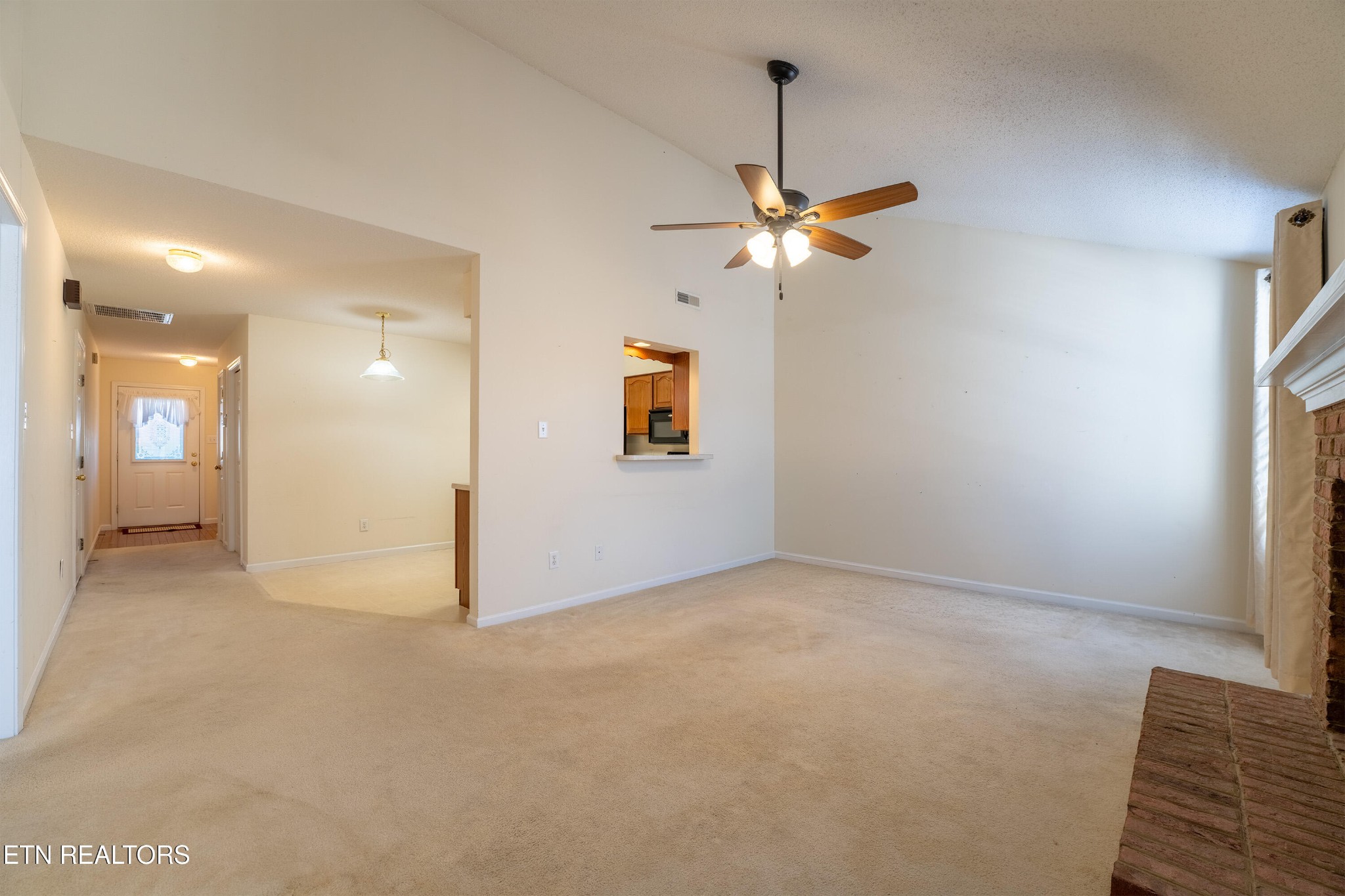 8024 Stablegate Way Powell, TN 37849 - Photo 11 of 35 a view of a big room with windows and ceiling fan