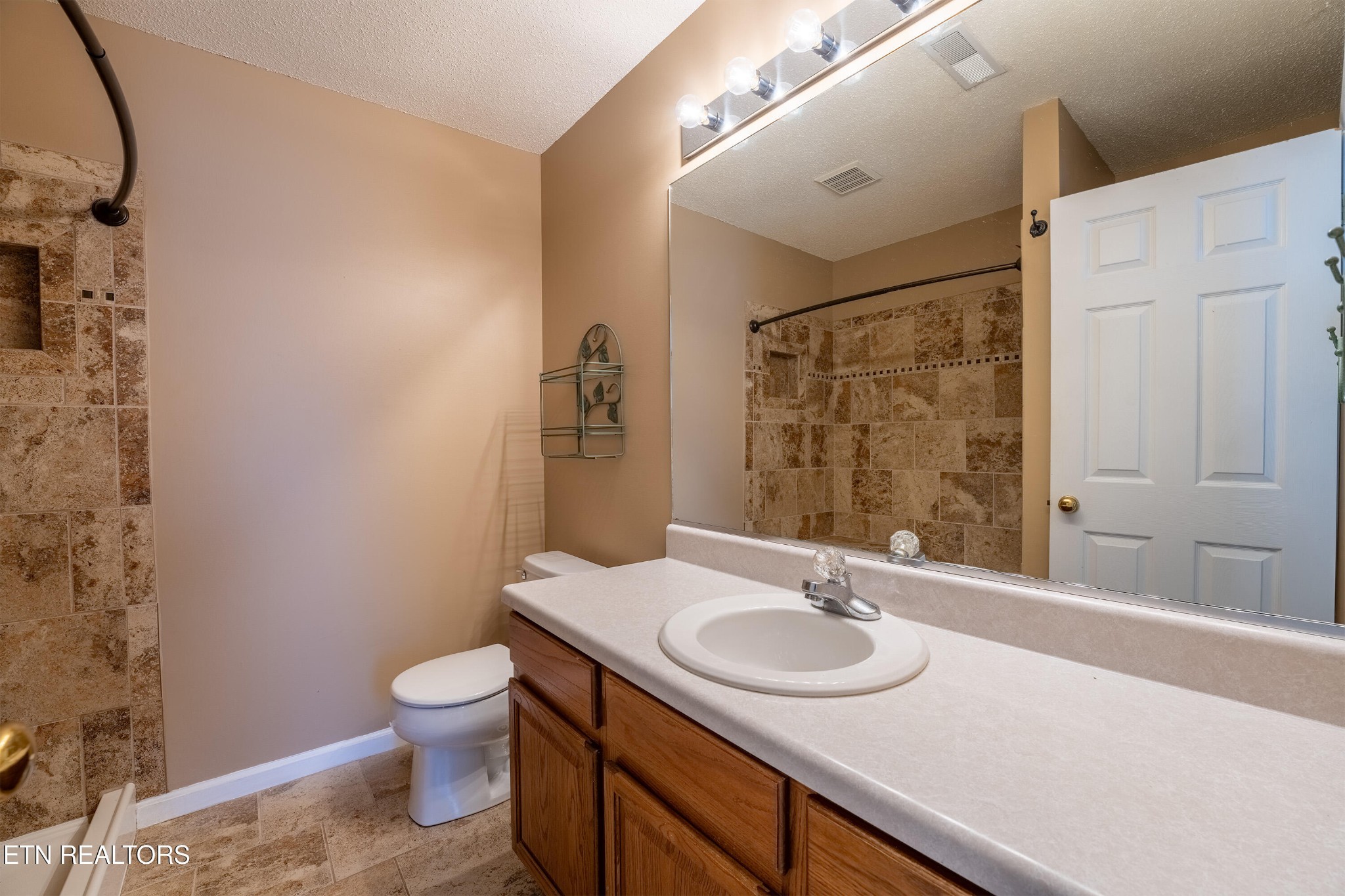 8024 Stablegate Way Powell, TN 37849 - Photo 14 of 35 a bathroom with a sink toilet and shower