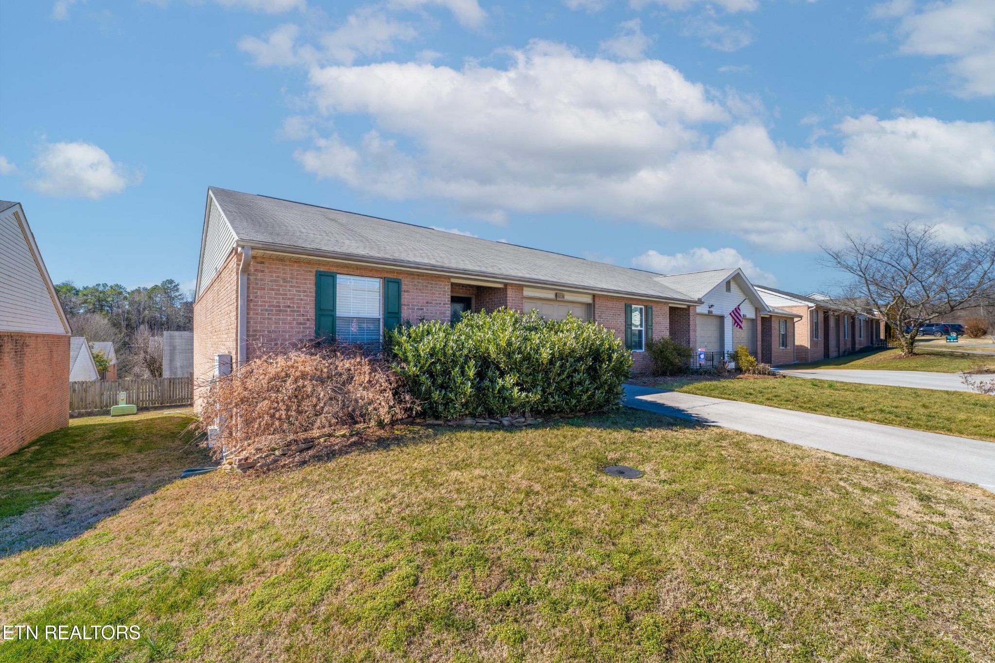 8024 Stablegate Way Powell, TN 37849 - Photo 2 of 35 a view of a house with a big yard and large trees