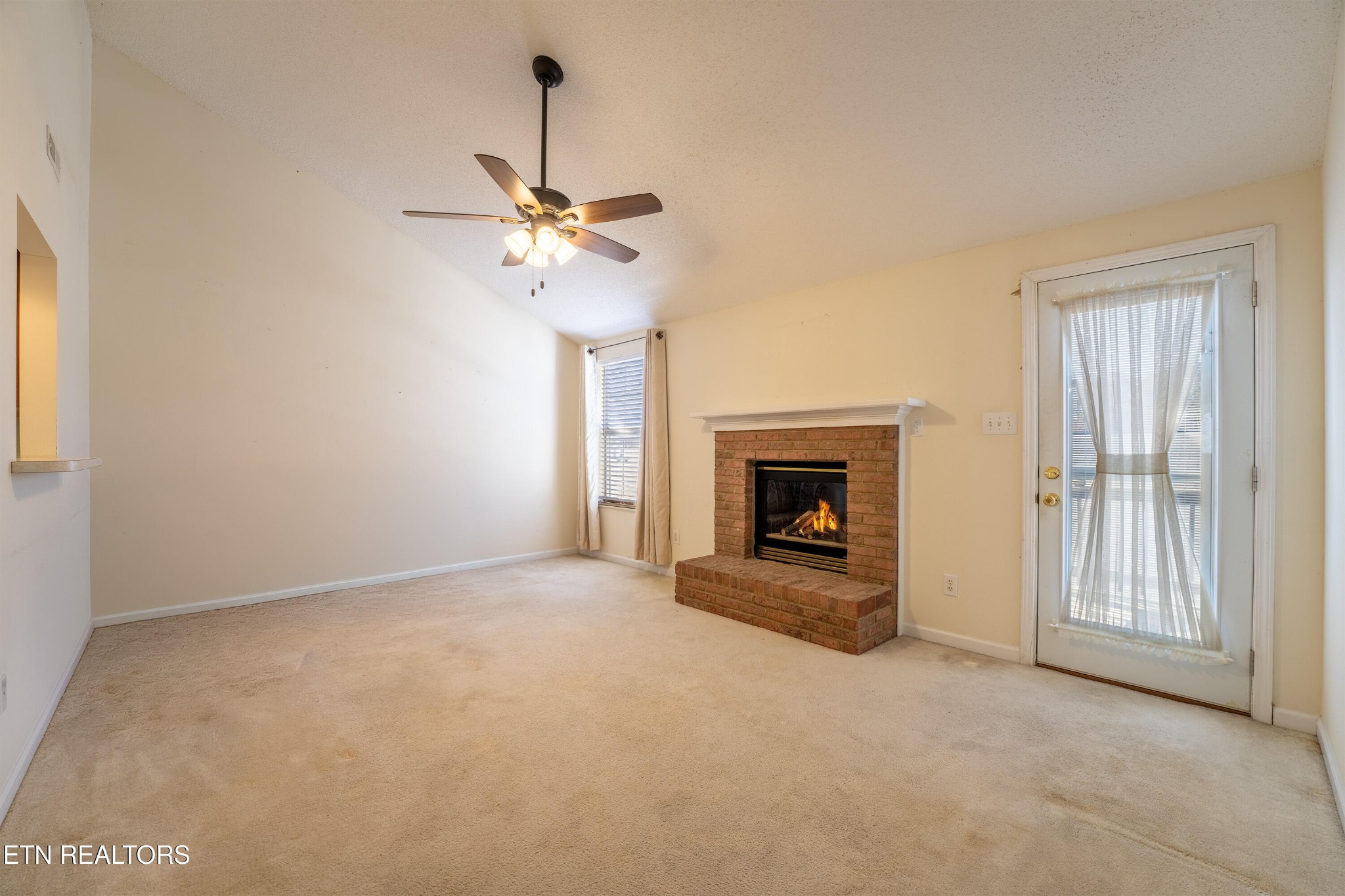 8024 Stablegate Way Powell, TN 37849 - Photo 9 of 35 a view of an empty room with a fireplace