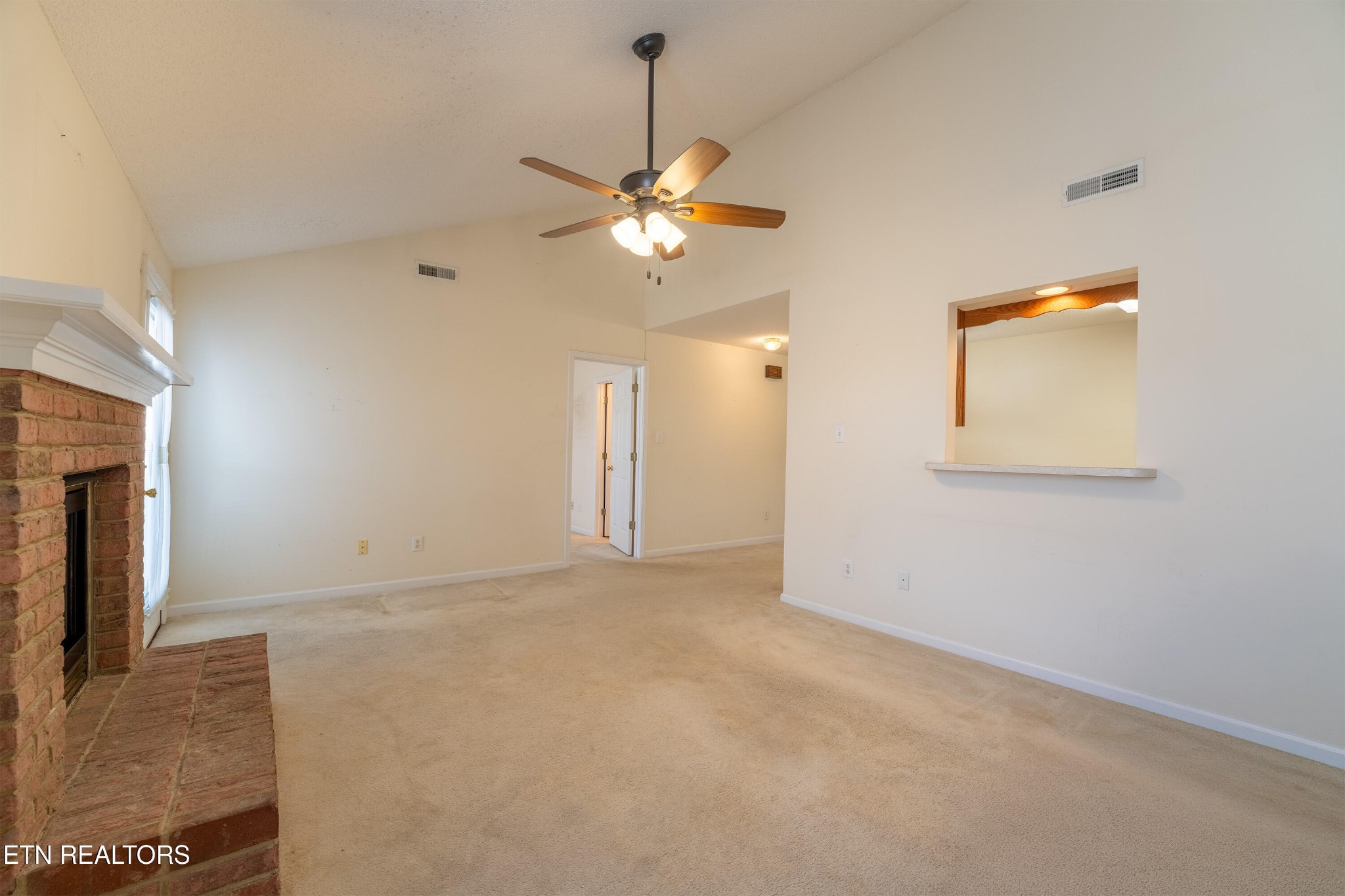 8024 Stablegate Way Powell, TN 37849 - Photo 10 of 35 a view of an empty room with a ceiling fan