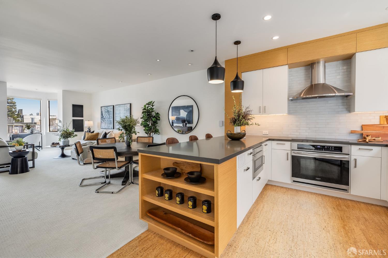 370 Church Street, Unit G San Francisco, CA 94114 - Photo 20 of 65 a large white kitchen with stainless steel appliances granite countertop a stove and a view of living room