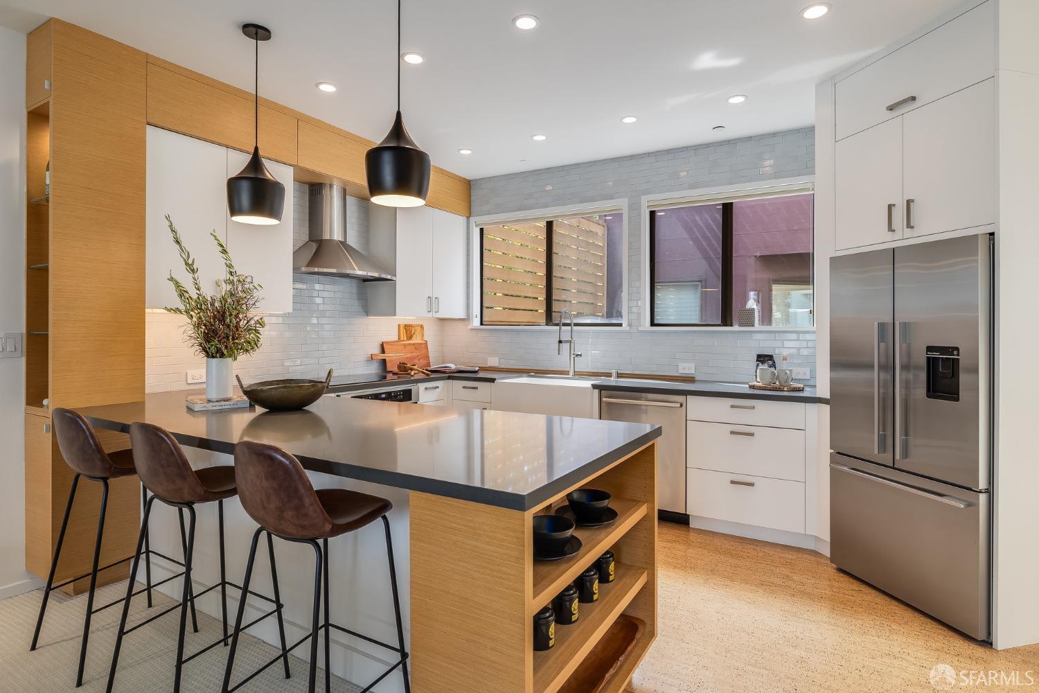 370 Church Street, Unit G San Francisco, CA 94114 - Photo 21 of 65 a kitchen with stainless steel appliances granite countertop a sink a stove a refrigerator and island with wooden floor