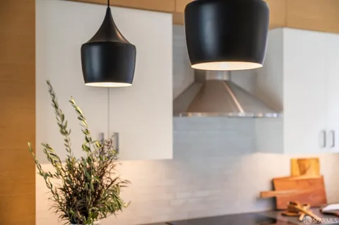 a view of a livingroom with furniture and staircase
