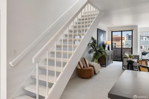 a view of balcony with furniture