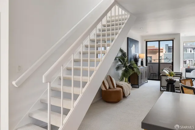 a view of balcony with furniture