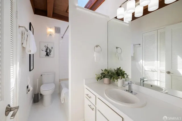 a side view of a backyard with table and chairs