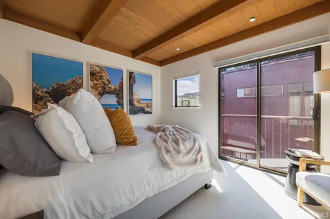 a backyard of a house with wooden floor and outdoor space