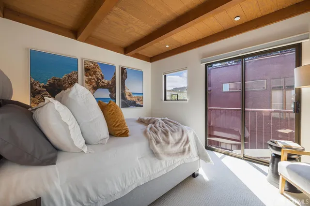 a backyard of a house with wooden floor and outdoor space