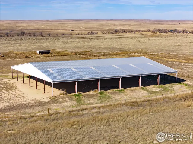 a house with pool and ocean view