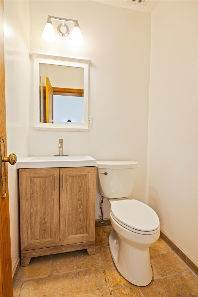 329 Convent Avenue Manhattan, NY 10031 - Photo 12 of 28 a bathroom with a toilet a sink and mirror
