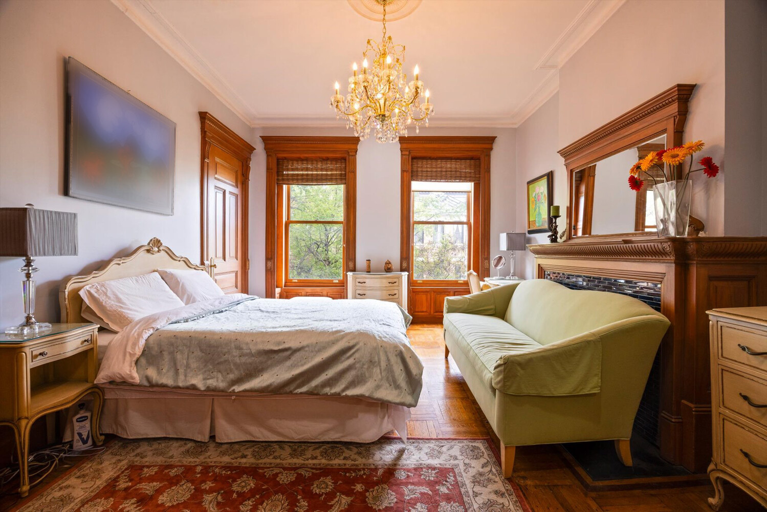 329 Convent Avenue Manhattan, NY 10031 - Photo 15 of 28 a bedroom with a bed and wooden floor