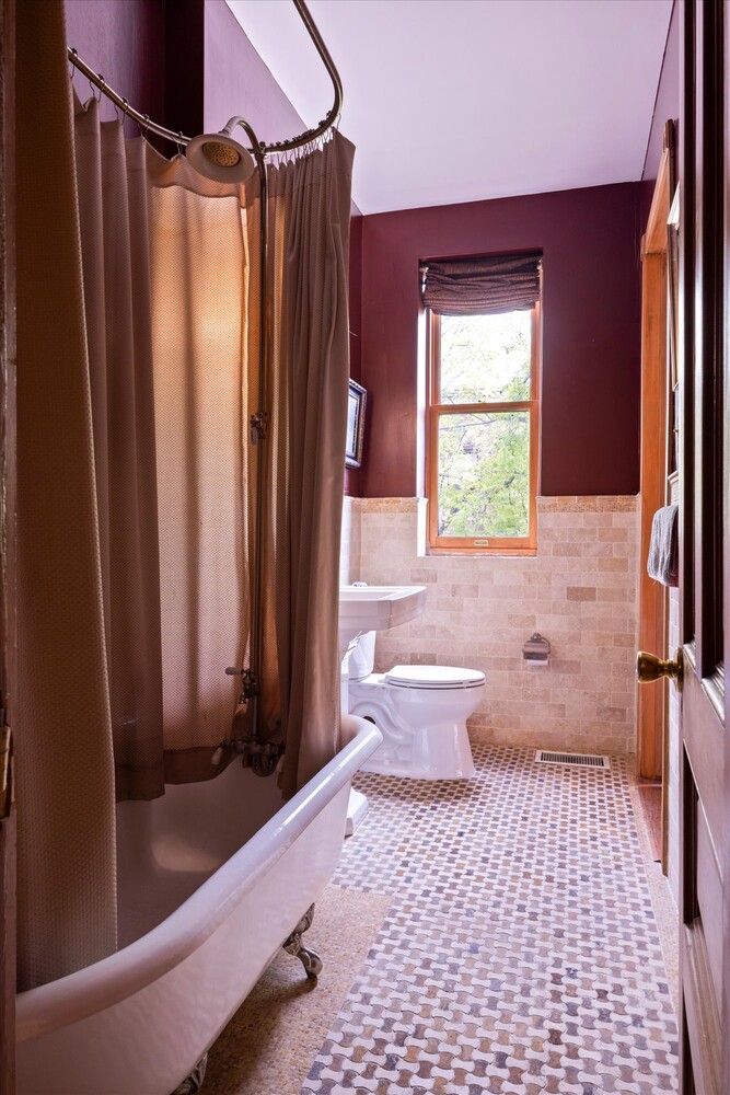 329 Convent Avenue Manhattan, NY 10031 - Photo 16 of 28 a bathroom with a sink a toilet and a shower