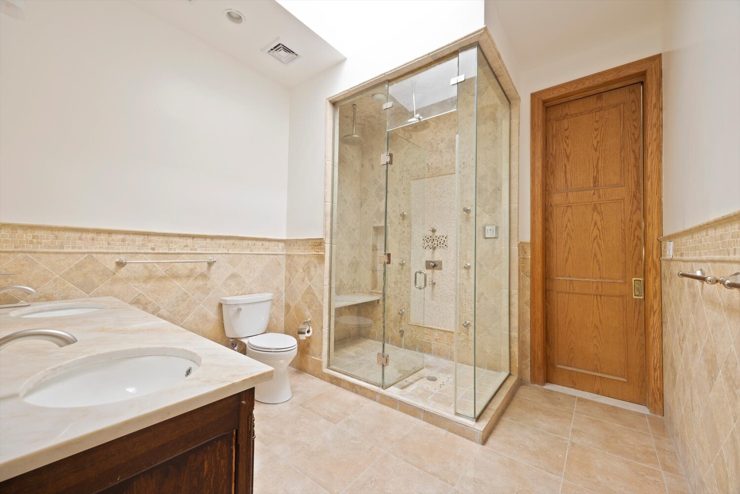 329 Convent Avenue Manhattan, NY 10031 - Photo 19 of 28 a bathroom with a shower sink and mirror